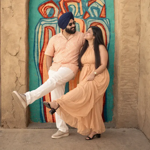 Playful leg kick: a couple photographed at Al Fahidi, Dubai