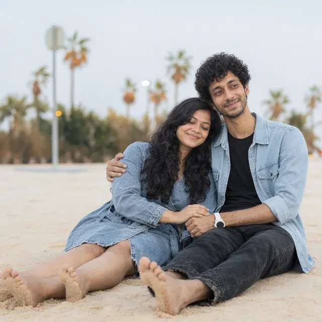 Resting on his shoulder: a couple photographed at Kite Beach, Dubai