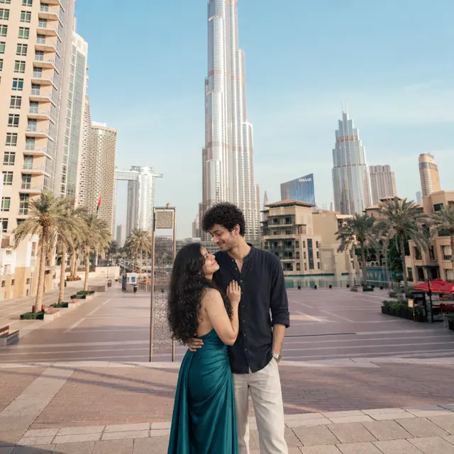 Skyline embrace: a couple photographed at Downtown Dubai, Dubai