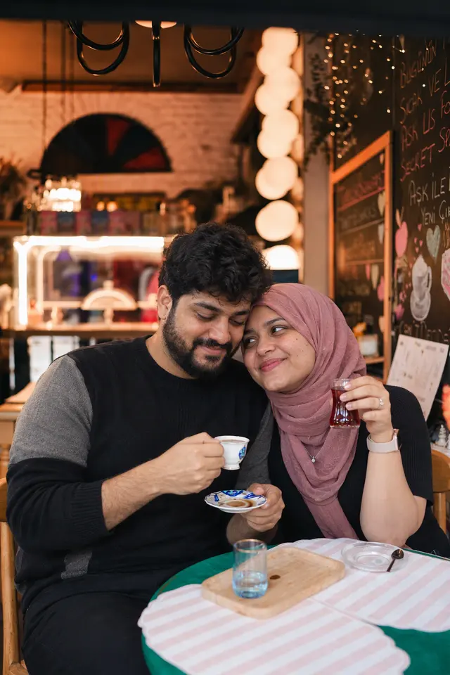 Laughing over tea: a couple photographed at An old-town café, Turkey