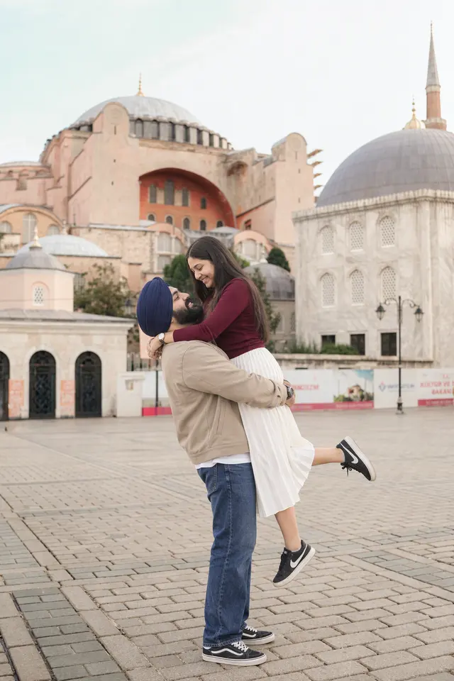 Lifted in laughter: a couple photographed at Hagia Sophia, Turkey