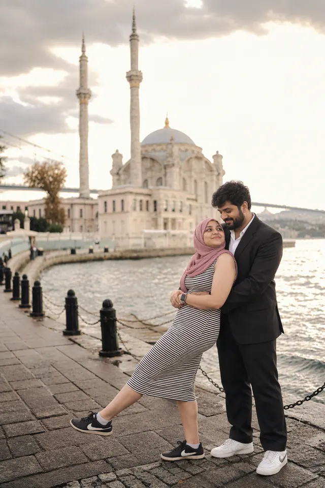Leaning back, laughing: a couple photographed at Bosphorus shore, Turkey
