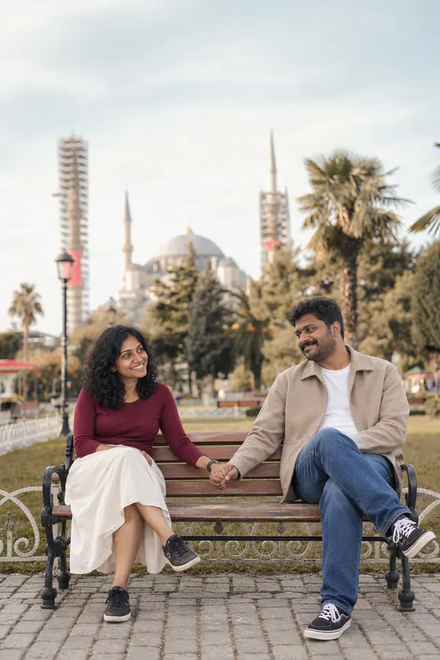 Holding hands on bench: a couple photographed at Old town, Turkey
