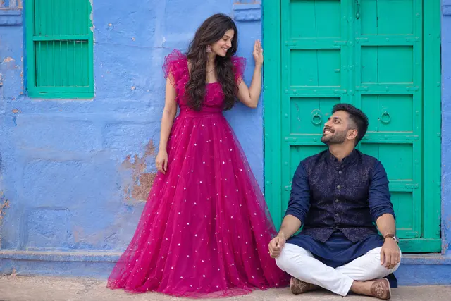 Smiling by the doorway: a couple photographed at Blue lanes, Jodhpur