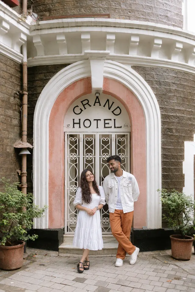 At the old hotel door: a couple photographed at Ballard Estate, Mumbai