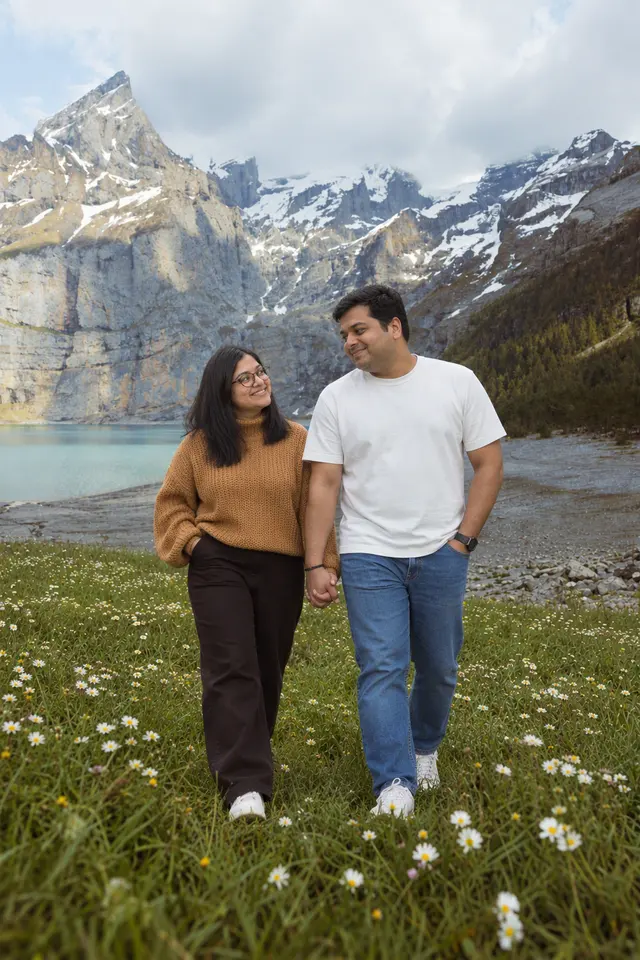 Walking by the lake: a couple photographed at An alpine lake, Switzerland