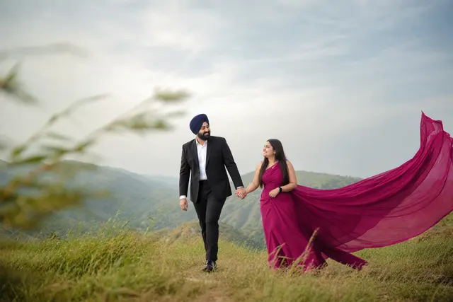 Walking with flying drape: a couple photographed at The Aravalli hills, Udaipur