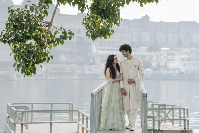 Smiling by the water: a couple photographed at Lake Pichola, Udaipur